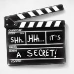 A photo of a clapperboard from one of the underrated Korean dramas, with the title of the show and a handwritten note like "Shh... It's a secret!"